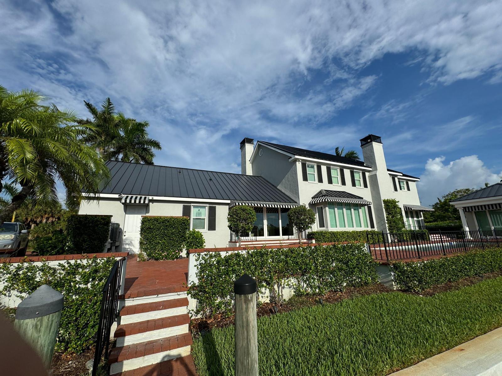 Coastal estate with a fresh exterior paint finish by house painters in Sarasota, FL