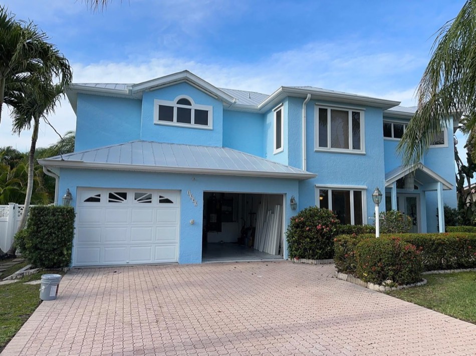 Exterior painting of a coastal home in Sarasota, FL