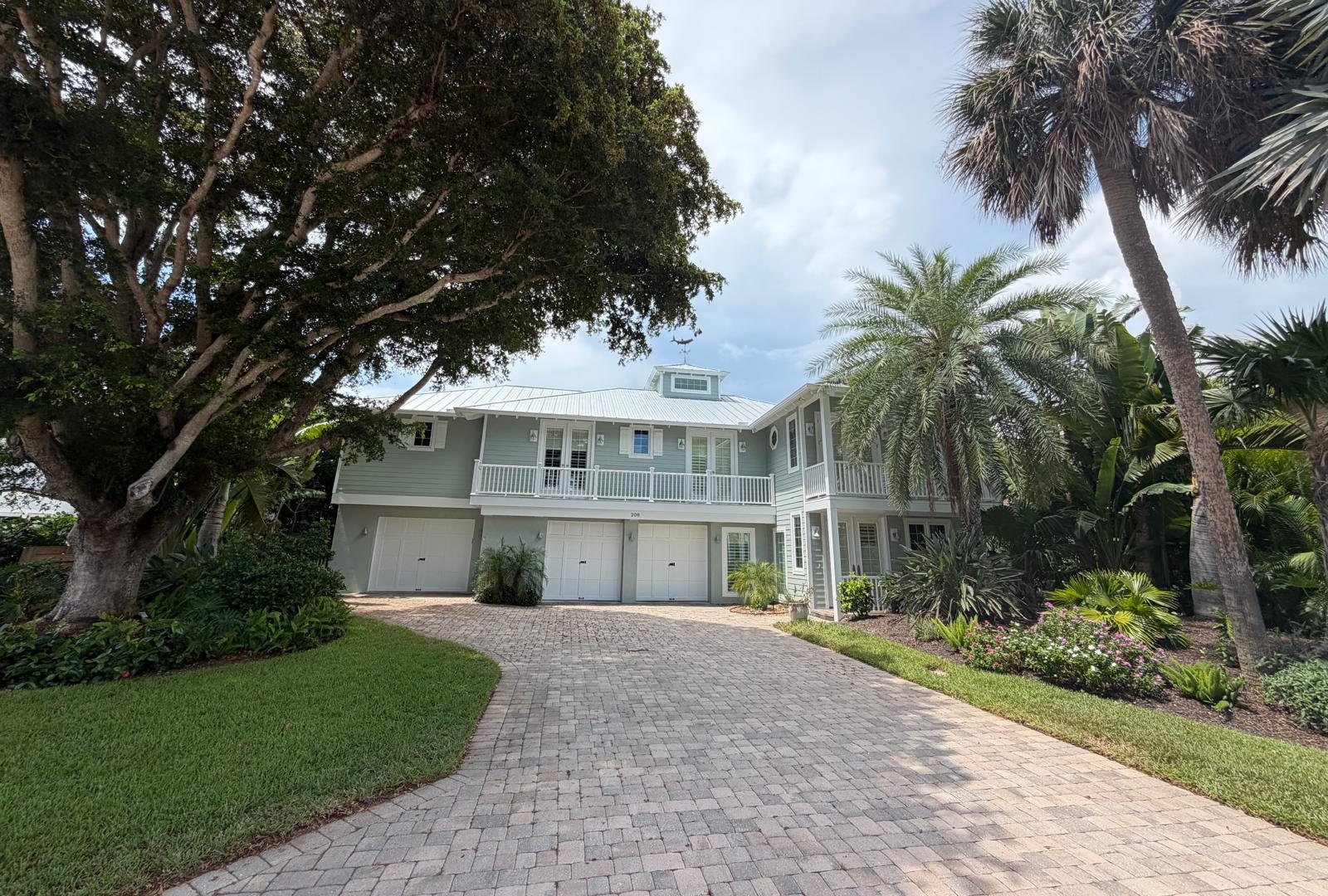 Pressure washing a paver driveway in Sarasota, FL